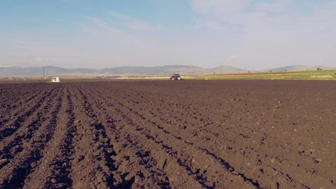 Tractor plowing the field 4K Stock Footage 127979023