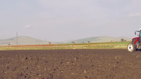 Tractor plowing the field 4K Stock Footage 127979122