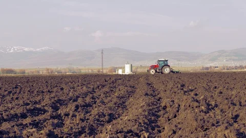 Tractor plowing the field 4K Stock Footage 127979148