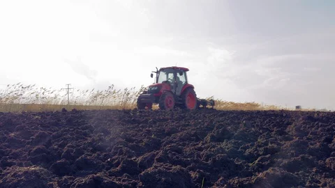 Tractor plowing the field 4K Stock Footage 128036193