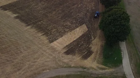 Tractor plowing field, 4K UHD Stock Footage 169478818