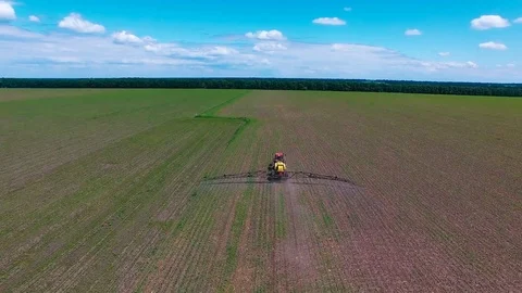 Tractor plowing a field. Aerial photography Stock Footage