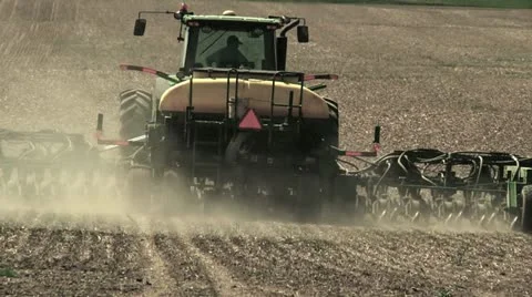 Tractor plowing a field close up Video stock 11401300