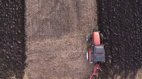Tractor plowing field on cloudy fall day. Aerial footage. Stock Footage 57374799