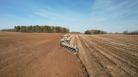 Tractor plowing field, drone view. Cultivated land and soil tillage. 스톡 동영상 191675996