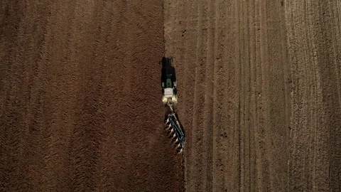 Tractor plowing field, drone view. Cultivated land and soil tillage. 스톡 동영상 191676026