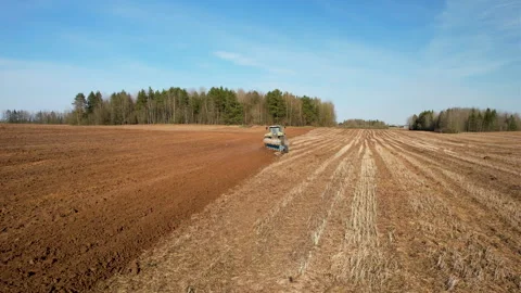 Tractor plowing field, drone view. Cultivated land and soil tillage. Video stock 191834055