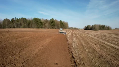 Tractor plowing field, drone view. Cultivated land and soil tillage. Video stock 191834106