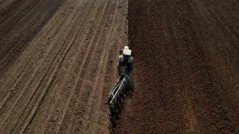Tractor plowing field, drone view. Cultivated land and soil tillage. Video stock 191835618