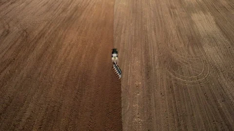 Tractor plowing field, drone view. Cultivated land and soil tillage. 스톡 동영상 191838388