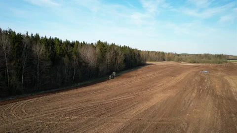 Tractor plowing field, drone view. Cultivated land and soil tillage. 스톡 동영상 191842057
