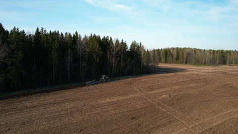 Tractor plowing field, drone view. Cultivated land and soil tillage. Video stock 191842186