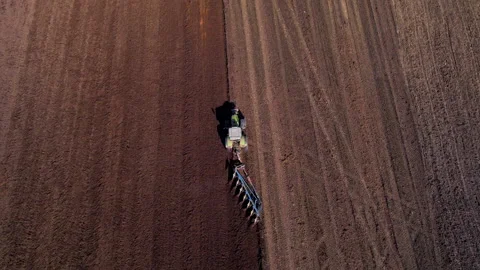 Tractor plowing field, drone view. Cultivated land and soil tillage. Video stock 191843423