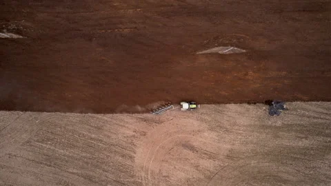 Tractor plowing field, drone view. Cultivated land and soil tillage. Stock Footage 193982008