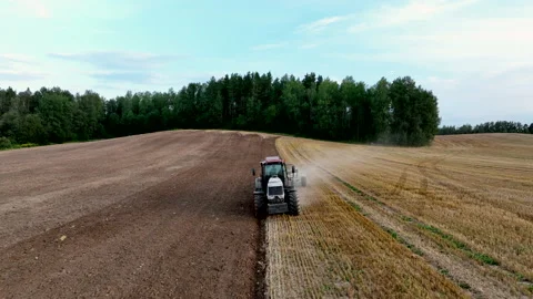 Tractor Plowing field, drone view. Cultivated and soil tillage Stockbeeldmateriaal 204822462