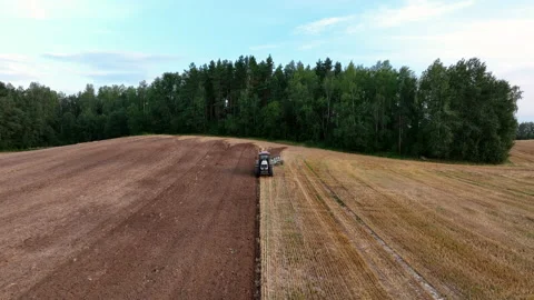 Tractor Plowing field, drone view. Cultivated and soil tillage Stock-Footage 204823422