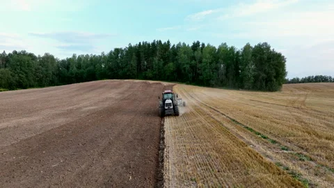 Tractor Plowing field, drone view. Cultivated and soil tillage Video stock 204824845