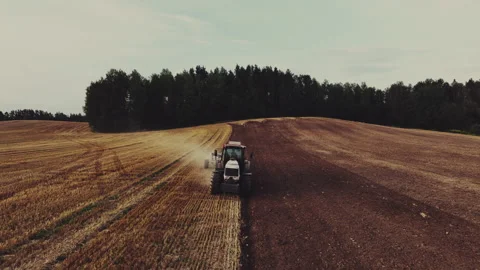 Tractor Plowing field, drone view. Cultivated and soil tillage Stock Footage 204845618