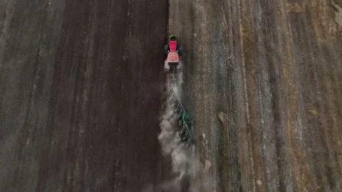 Tractor Plowing field, drone view. Cultivated and soil tillage. Video stock 206573667