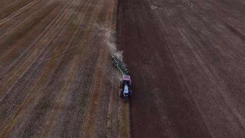 Tractor Plowing field, drone view. Cultivated and soil tillage. 動画素材 206579763