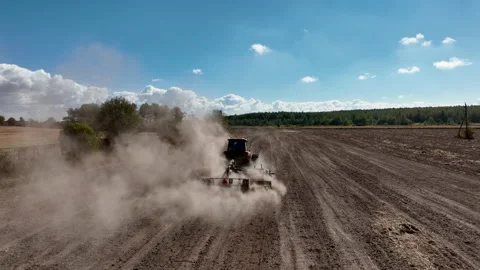 Tractor Plowing field, drone view. Cultivated and soil tillage. Видео 211443429