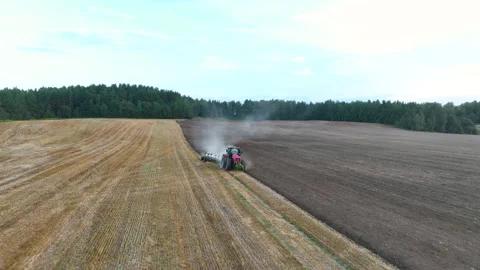 Tractor Plowing field, drone view. Cultivated and soil tillage Stock-Footage 212454535