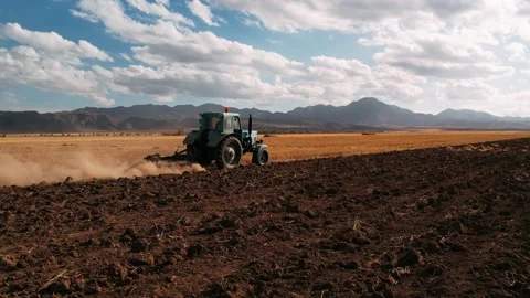 Tractor Plowing field, drone view. Cultivated and soil tillage. Tractor on land 스톡 동영상 233456326