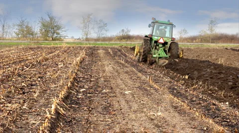 Tractor plowing a field Stock Footage 952570
