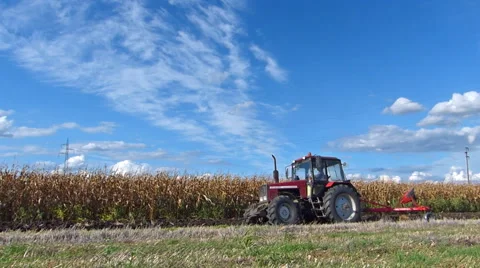 Tractor plowing a field Stock Footage 41443394