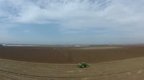 Tractor plowing a field Stock Footage 46551593