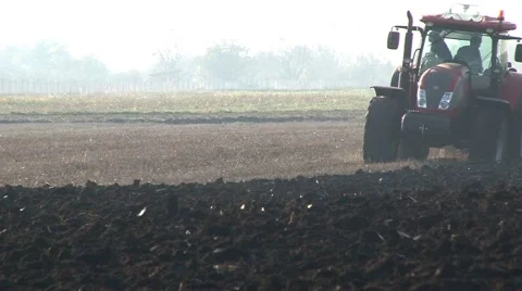 Tractor Plowing A Field Stock Footage 58413669