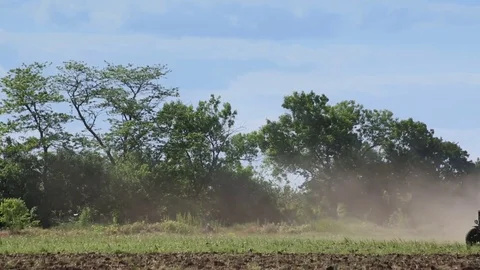 Tractor plowing field Stock Footage 77263663