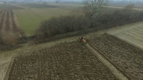 Tractor plowing the field Stock Footage 78226597