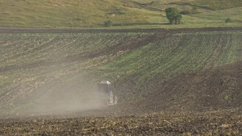 Tractor plowing field Stock Footage 85325325