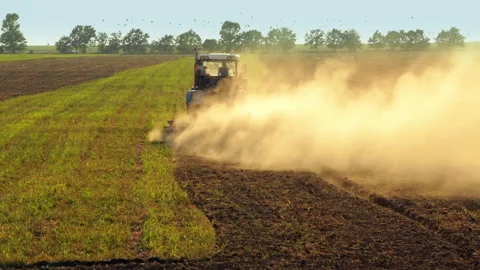 Tractor Plowing a Field Видео 106466632