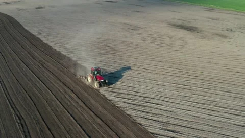 Tractor plowing field Stock Footage 130553770