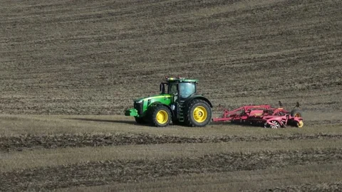 Tractor plowing a field Video stock 209156781