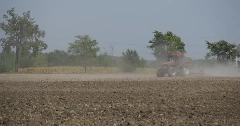 Tractor is Plowing The Field Passing by Camera Plowing the Field long the Road Stock Footage 53624462