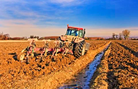 Tractor plowing field Foto stock