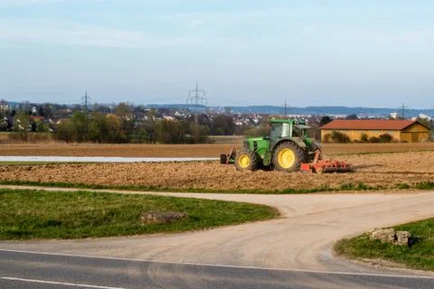 Tractor plowing a field Stock Photos