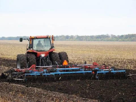 Tractor plowing a field Stock Photos