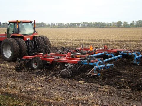 Tractor plowing a field Stock Photos