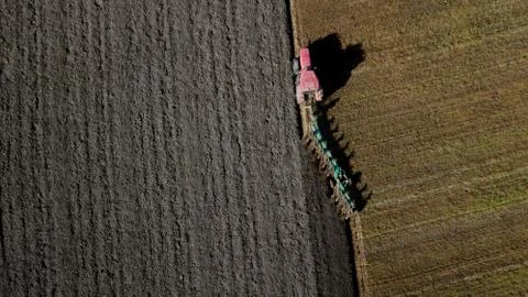 Tractor plowing the field Stock Photos