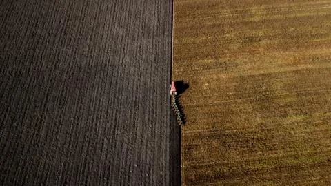 Tractor plowing the field Stock Photos