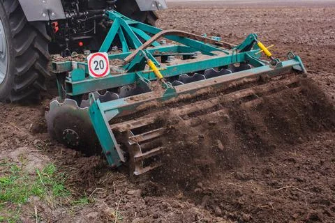 Tractor plowing a field. Stock Photos