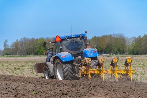 Tractor plowing a field Stock Photos