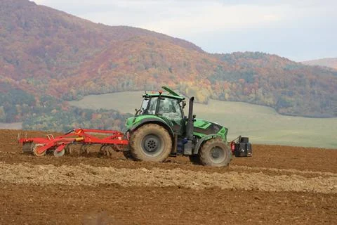 Tractor plowing a field Stock Photos