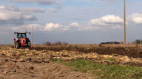 Tractor plowing field in sunny fall day. Stock Footage 48846549