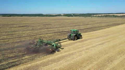 Tractor plowing the field top view aerial photography from a quadcopter Stock Footage 137006849