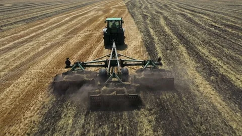 Tractor plowing the field top view aerial photography from a quadcopter Video stock 137006900